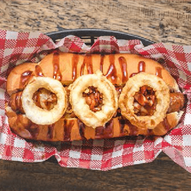 Hot dog with orange bbq sauce